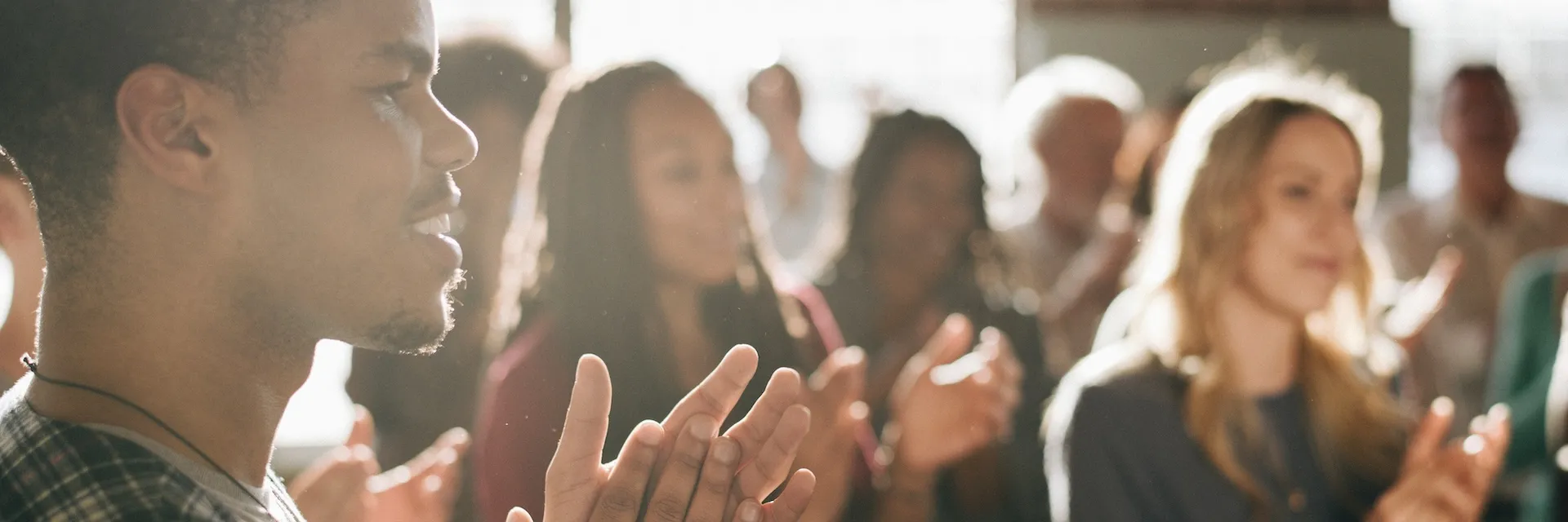 A group of people clapping